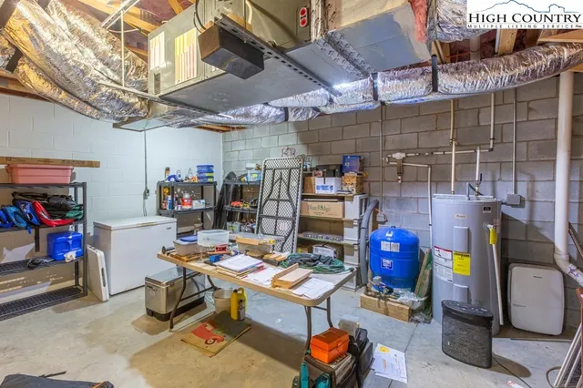 a bathroom with a sink a mirror a toilet and shower