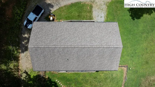 a view of a deck with a bench and wooden floor