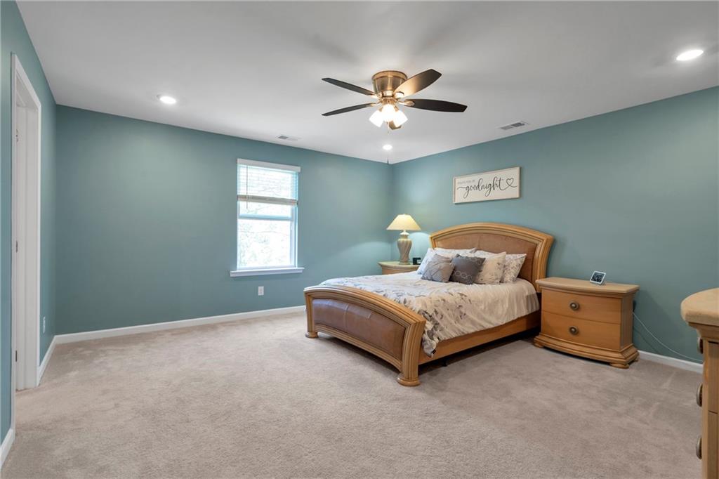 660 Groover Street Ball Ground, GA 30107 - Photo 23 of 53 a bedroom with a bed and window