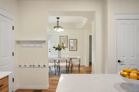 a dining room with furniture and chandelier