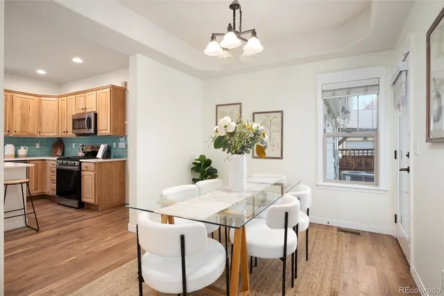 a view of a dining room with furniture window and wooden floor