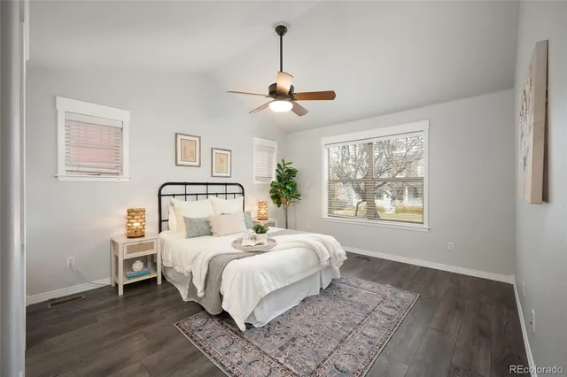 a bedroom with a large bed and a window