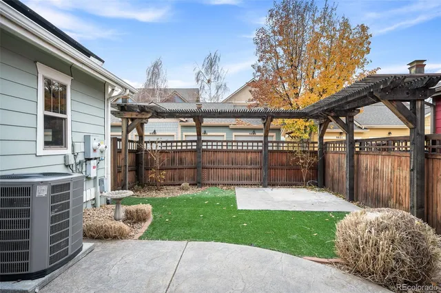 a view of a backyard with a garden and plants