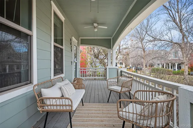 a view of a chair and tables in the balcony