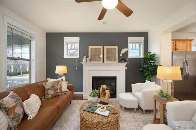 a living room with furniture and a fireplace