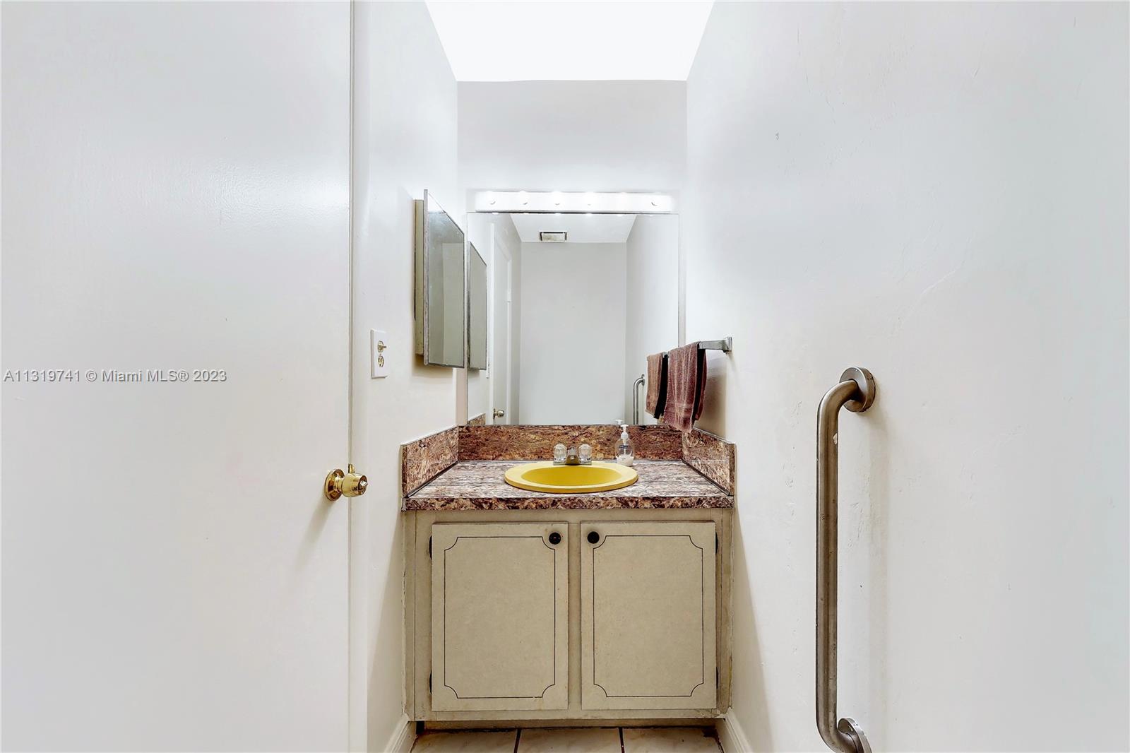 Hialeah Hialeah, FL 33014 - Photo 16 of 34 a bathroom with a sink and a mirror