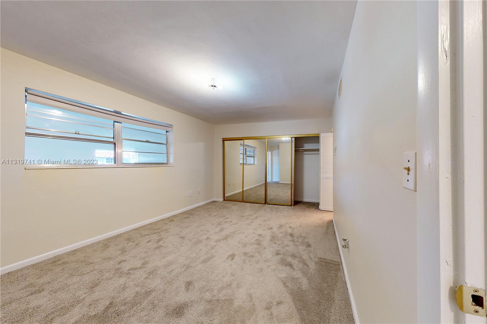 Hialeah Hialeah, FL 33014 - Photo 18 of 34 an empty room with windows and closet