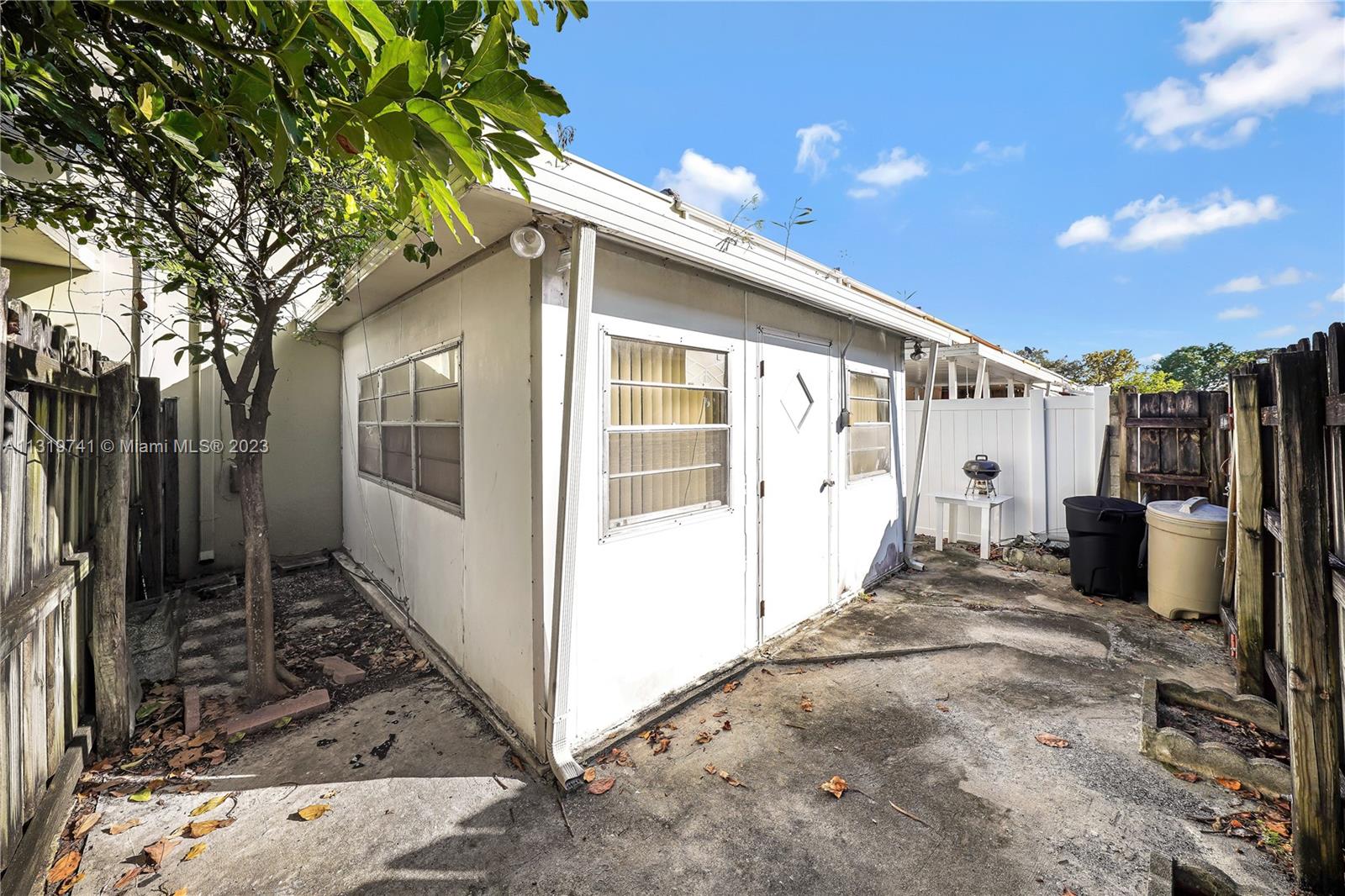 Hialeah Hialeah, FL 33014 - Photo 33 of 34 a view of a house with a backyard