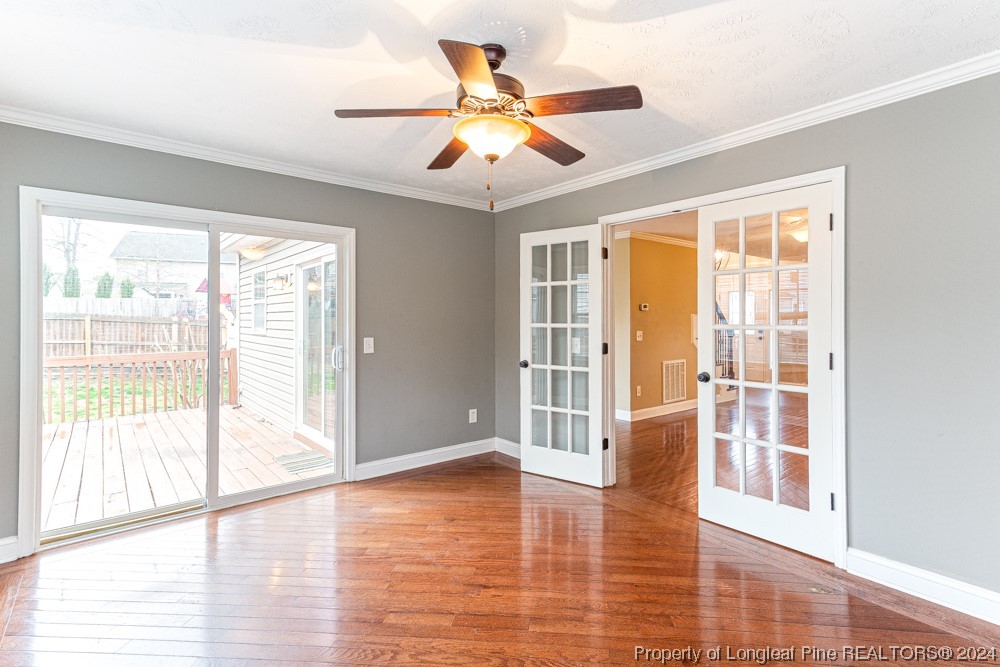 44 Ambrose Point Cameron, NC 28326 - Photo 11 of 48 a view of an empty room with wooden floor and a window