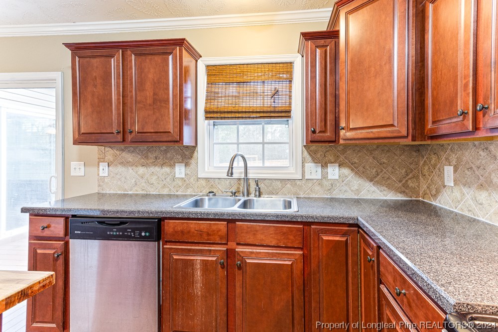 44 Ambrose Point Cameron, NC 28326 - Photo 17 of 48 a kitchen with stainless steel appliances granite countertop a sink and a cabinets