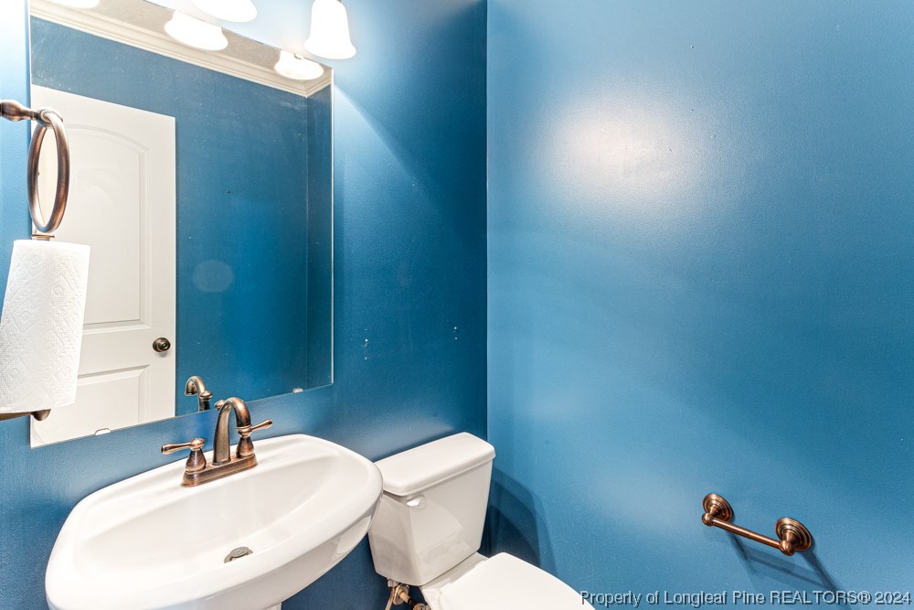 44 Ambrose Point Cameron, NC 28326 - Photo 21 of 48 a bathroom with a sink mirror and toilet