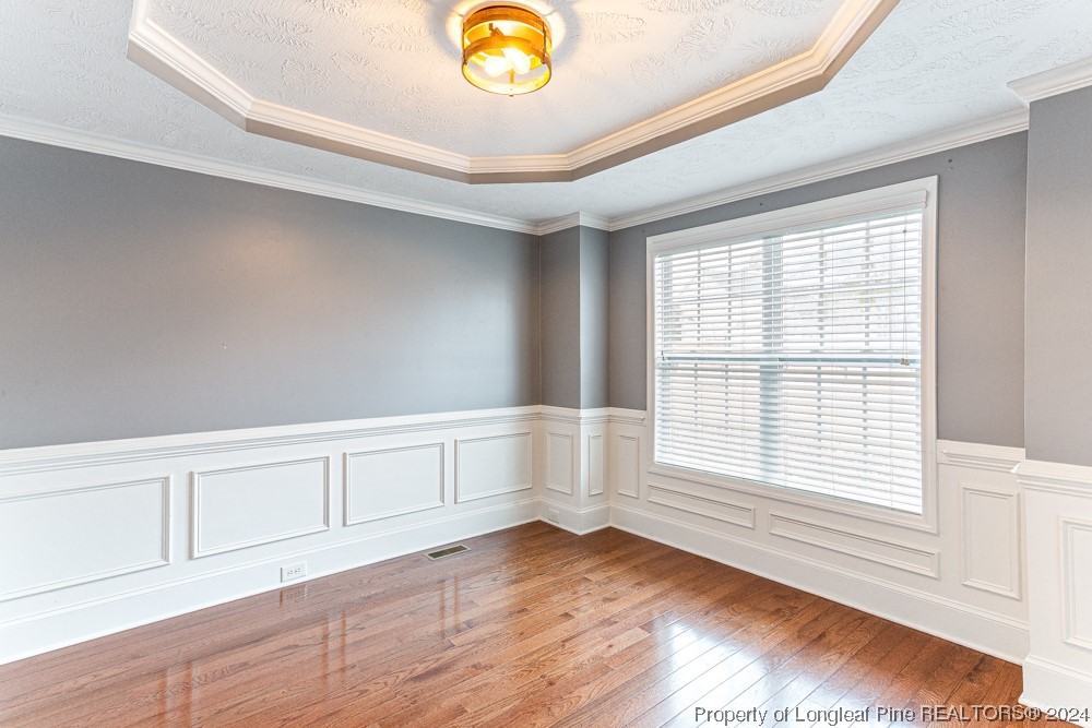 44 Ambrose Point Cameron, NC 28326 - Photo 22 of 48 a view of an empty room with wooden floor and a window