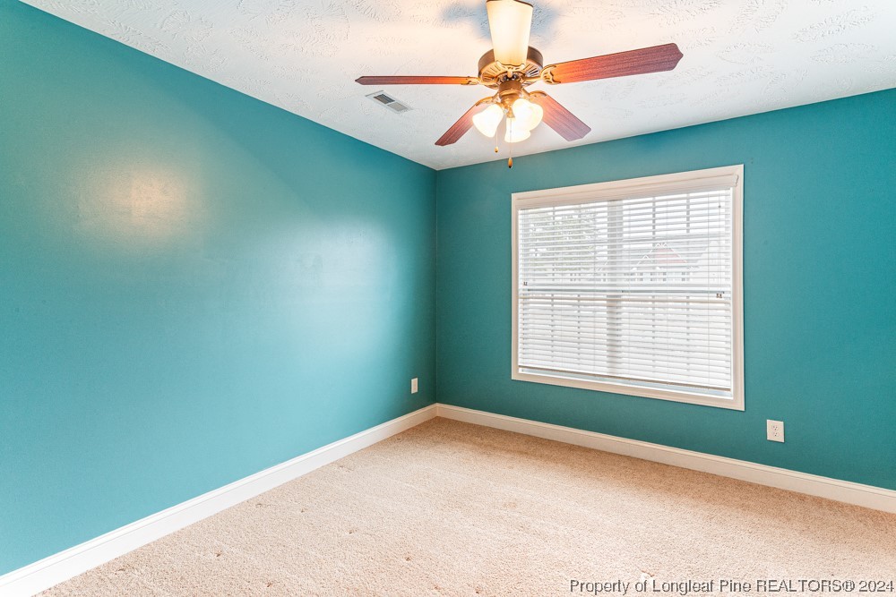 44 Ambrose Point Cameron, NC 28326 - Photo 24 of 48 a view of empty room with window and fan