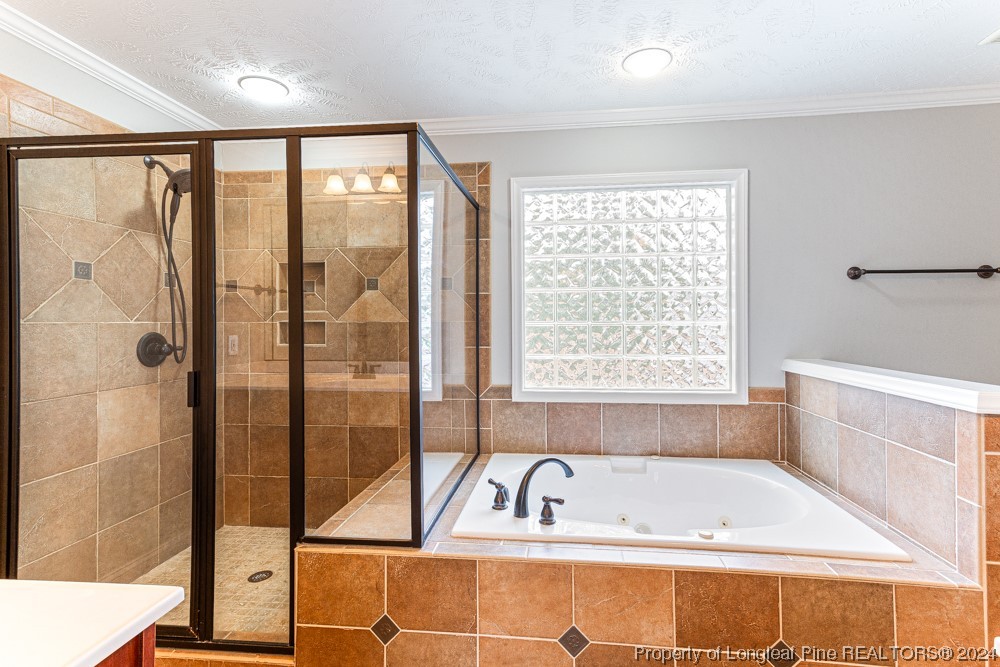 44 Ambrose Point Cameron, NC 28326 - Photo 30 of 48 a bathroom with a bathtub and a shower