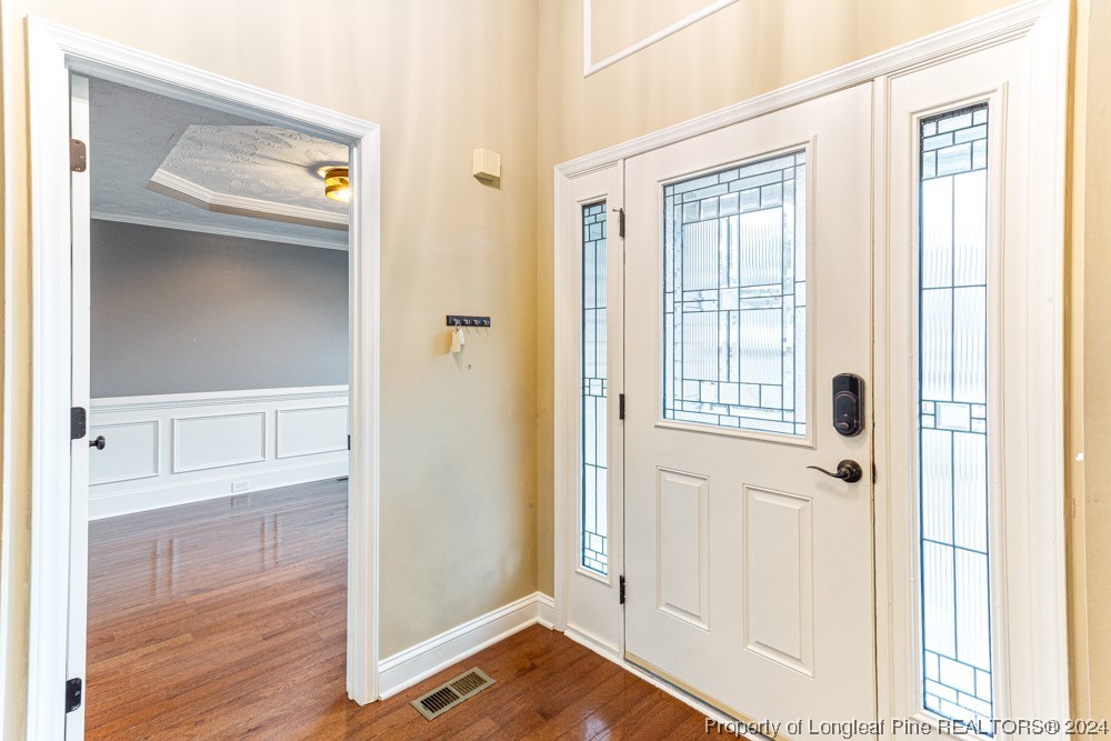 44 Ambrose Point Cameron, NC 28326 - Photo 3 of 48 a view of a bedroom with wooden floor & cabinet
