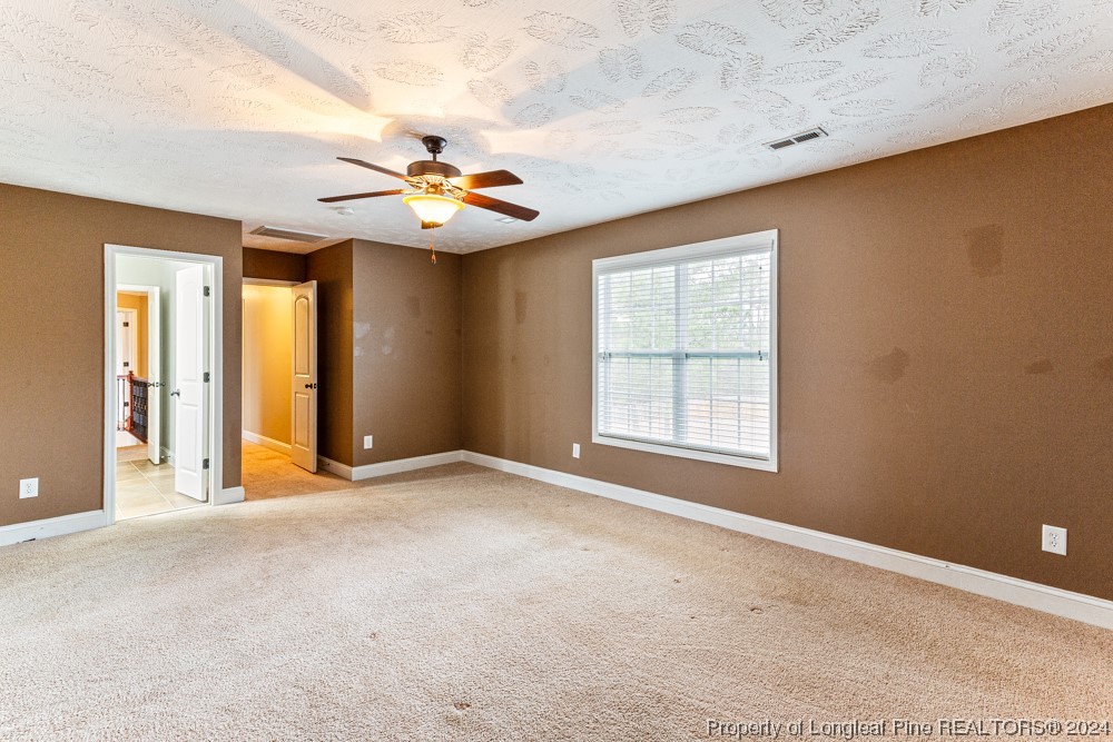 44 Ambrose Point Cameron, NC 28326 - Photo 36 of 48 an empty room with windows and fan
