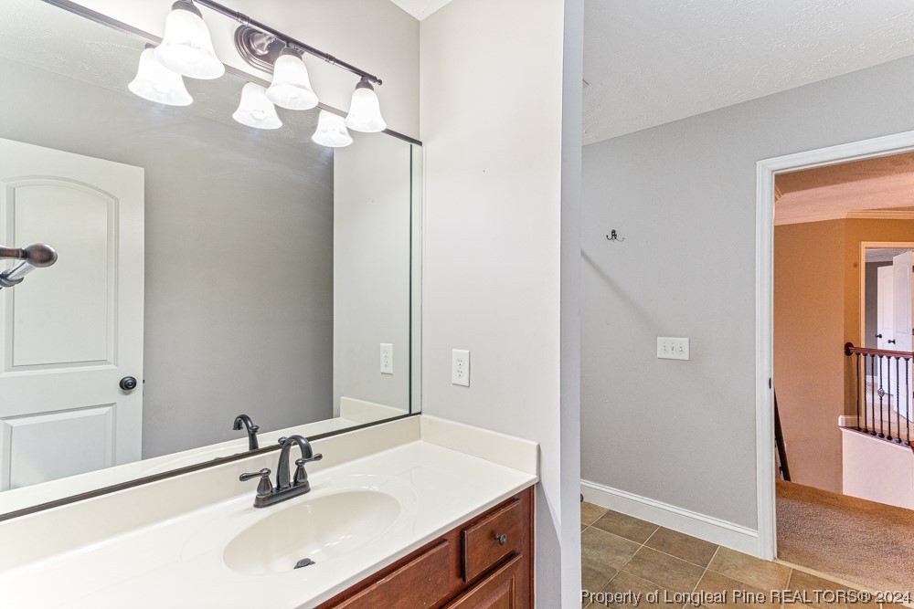 44 Ambrose Point Cameron, NC 28326 - Photo 40 of 48 a bathroom with a sink vanity and mirror
