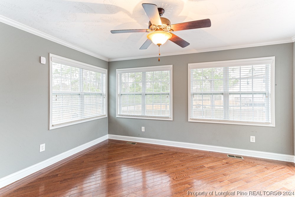 44 Ambrose Point Cameron, NC 28326 - Photo 10 of 48 a view of an empty room with wooden floor and a window
