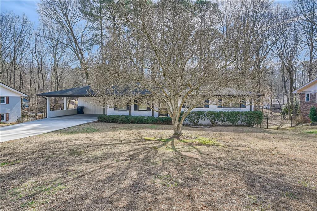 571 Carlouetta Road Mableton, GA 30126 - Photo 1 of 1 a view of a yard with a tree