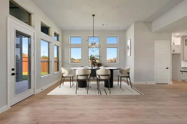 a large bedroom with a large bed and a large window