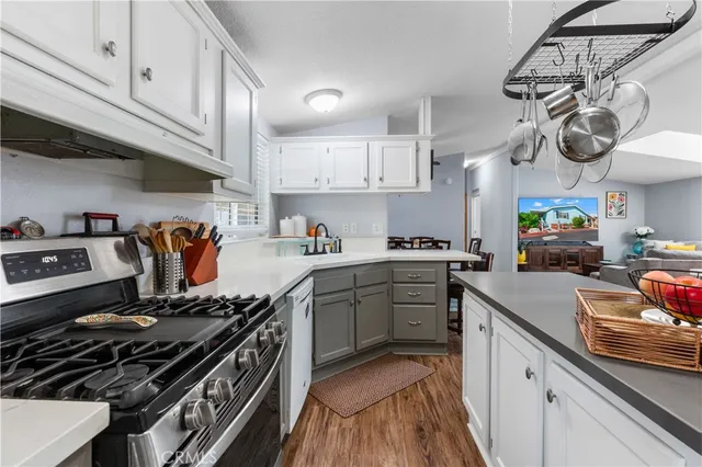 a kitchen with a stove and a white cabinets