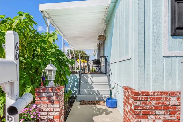 a backyard of a house with outdoor seating