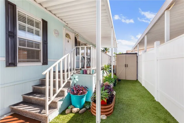 a view of two chairs in the patio