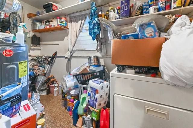 a bedroom with furniture and a fan