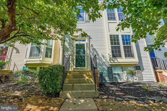 a view of a brick house with a large windows