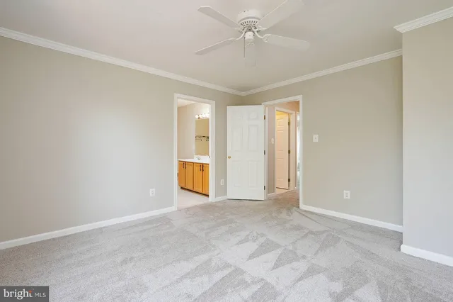 an empty room with a empty space and windows