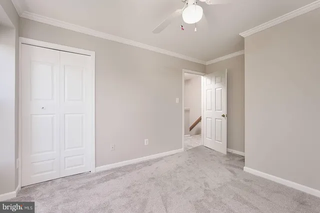 a view of an empty room and a bathroom