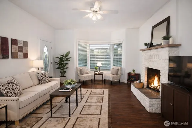 a view of a dining room with furniture and wooden floor