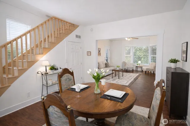 a view of a dining room with furniture window and wooden floor