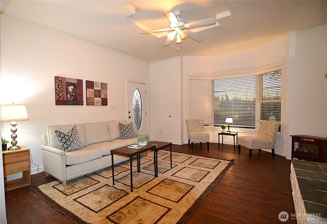 a view of a livingroom with furniture and a fireplace