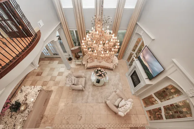 a view of a hallway with a dining table chairs and entryway
