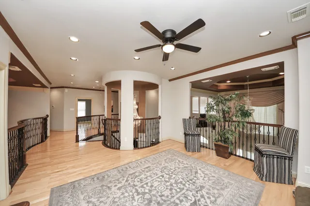 a bedroom with a large bed and a large window