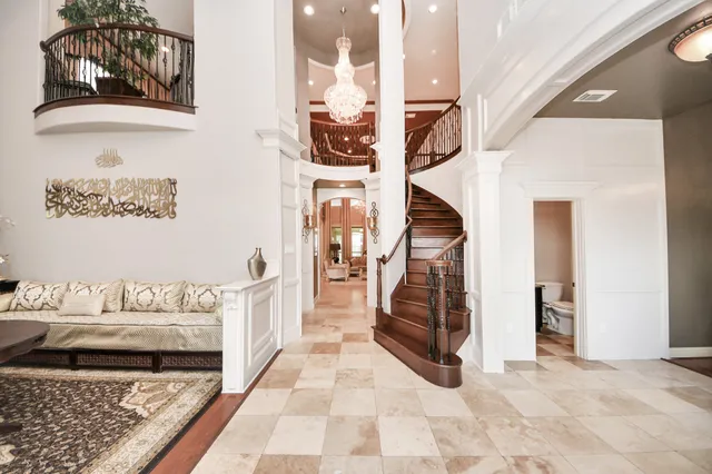 a view of an entryway with wooden floor