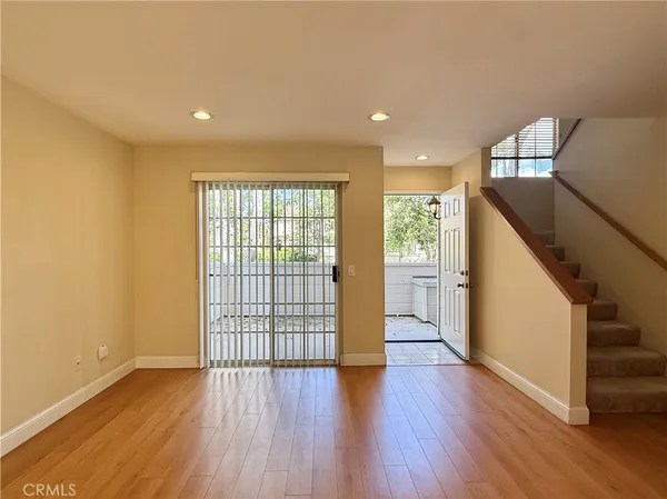 a view of entryway with wooden floor