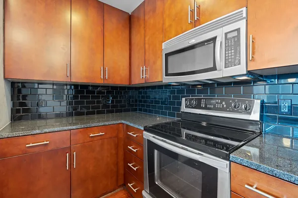 a view of a kitchen and a window