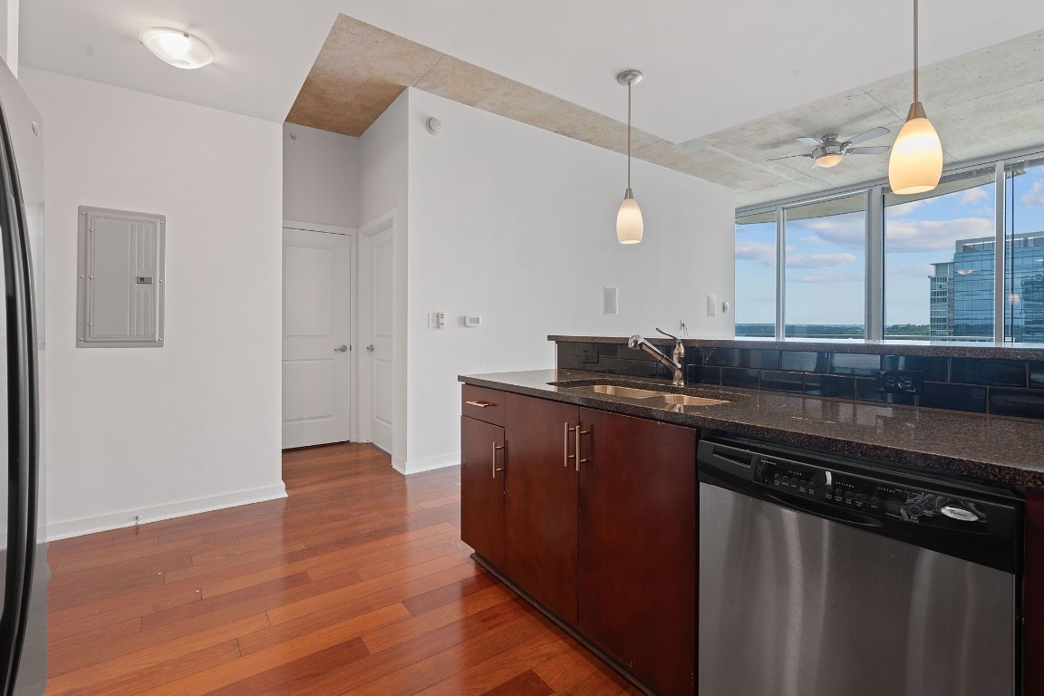 360 Nueces Street, Unit 1518 Austin, TX 78701 - Photo 14 of 35 a kitchen with a sink and a refrigerator