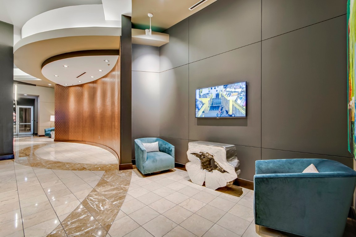 360 Nueces Street, Unit 1518 Austin, TX 78701 - Photo 26 of 35 a bedroom with a bed and a chandelier