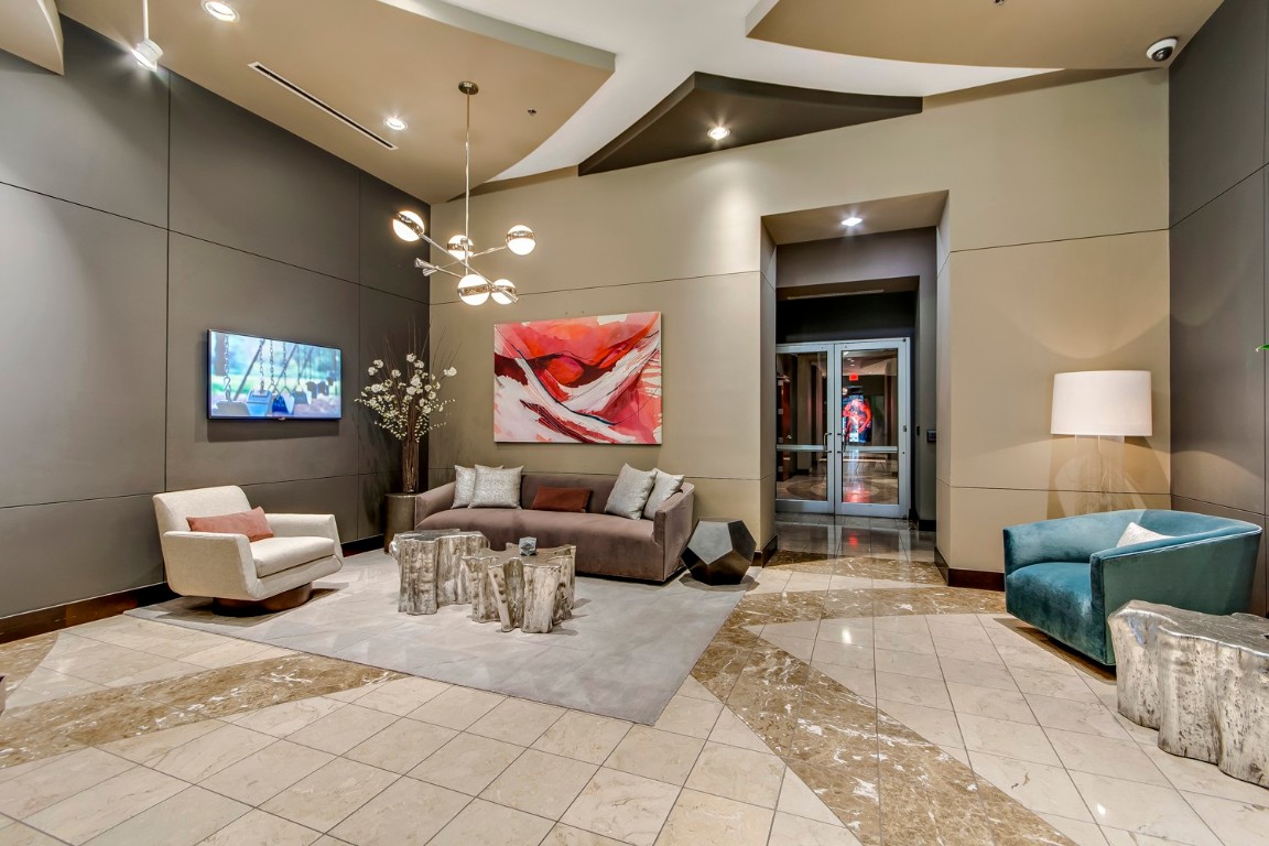 360 Nueces Street, Unit 1518 Austin, TX 78701 - Photo 27 of 35 a living room with furniture and a chandelier