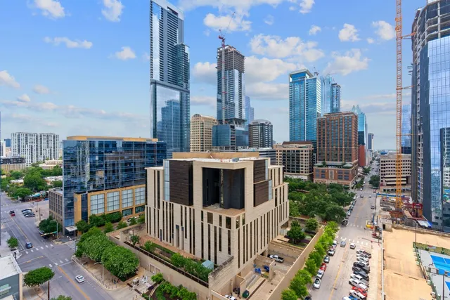 a view of a city with tall buildings