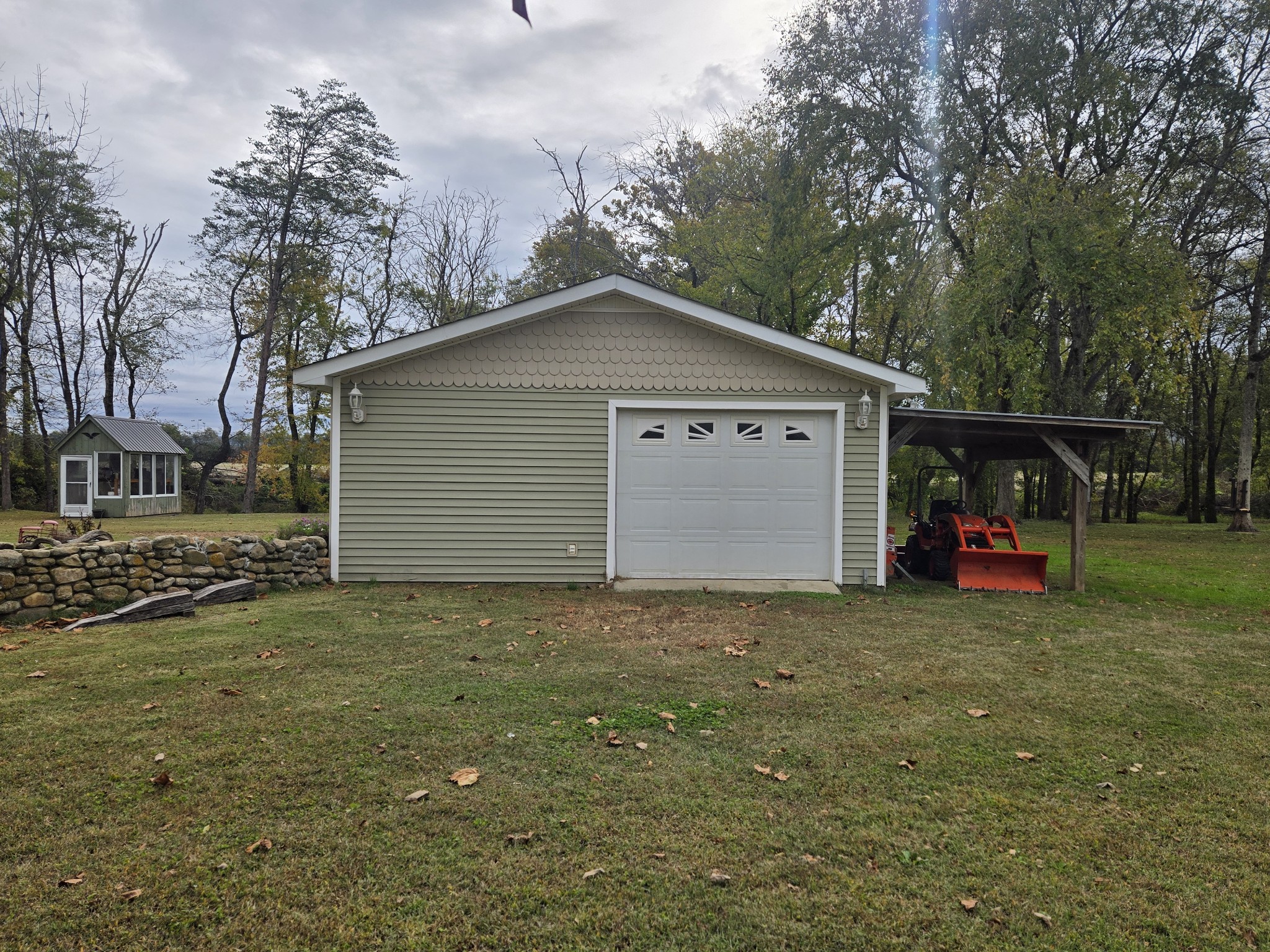 774 Sherrell Road Hillsboro, TN 37342 - Photo 21 of 70 a view of a house with a yard and garage