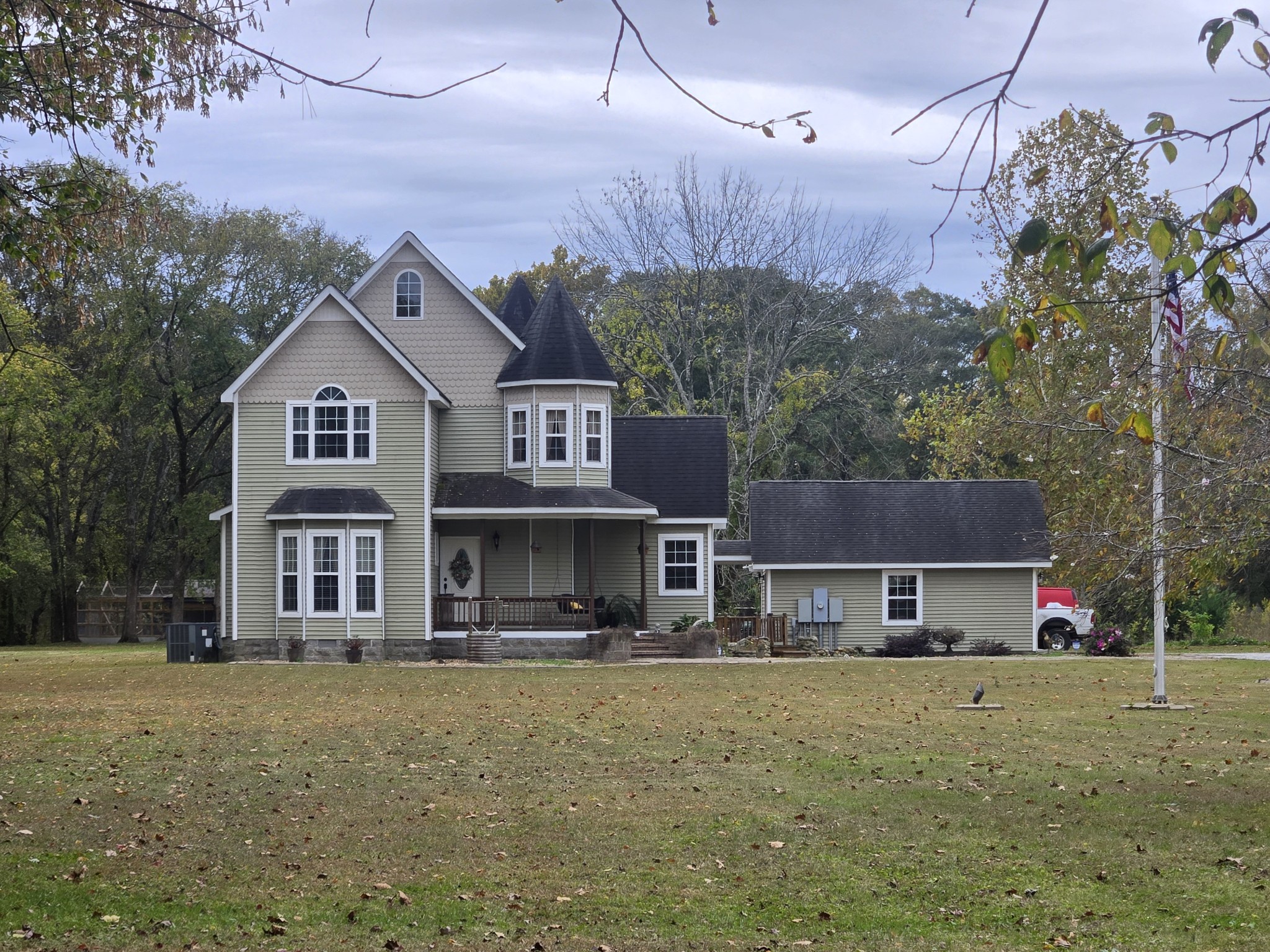 774 Sherrell Road Hillsboro, TN 37342 - Photo 4 of 70 a front view of a house with a yard and a garage
