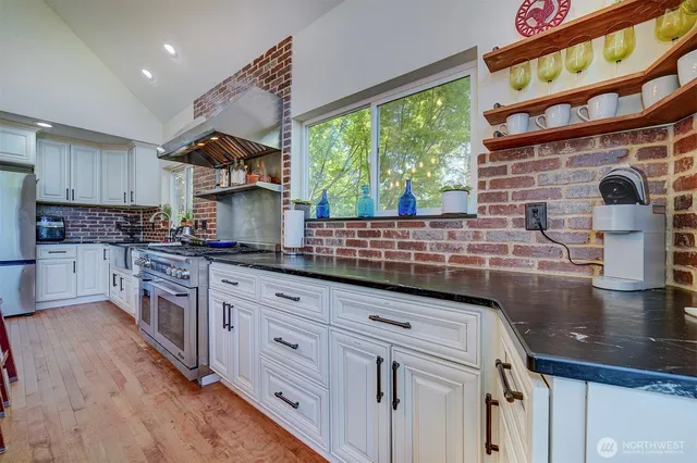 a room with table chairs and windows