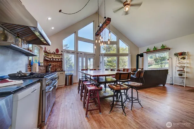 a bedroom with a bed and a flat tv screen on a dresser