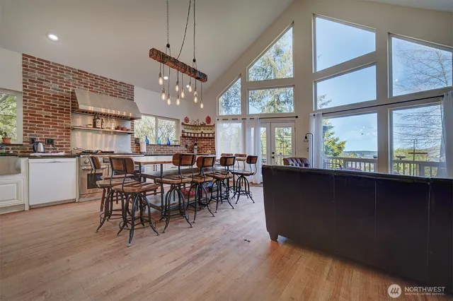 a bathroom with a sink a mirror a toilet and shower