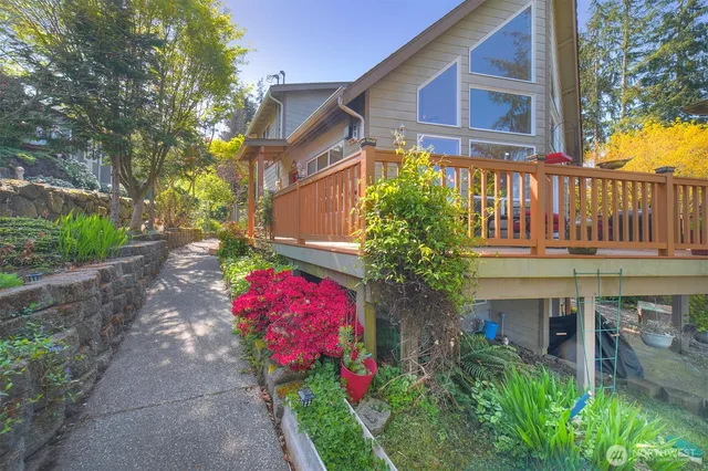 a front view of small house with yard and seating area