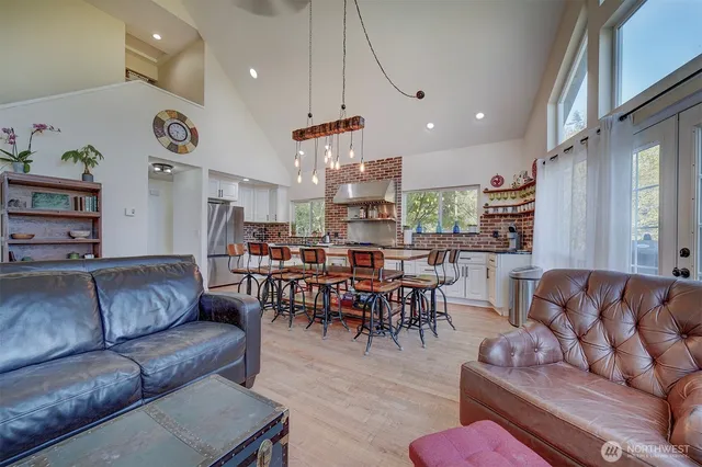 a kitchen with stainless steel appliances granite countertop a sink and cabinets